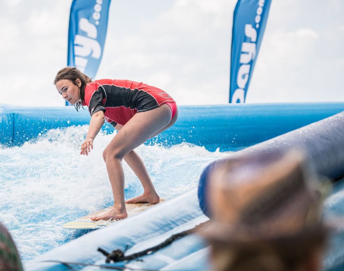 Rider on a mobile surf wave installation